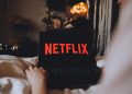 Why is Netflix considering going all-cash for WBD assets?